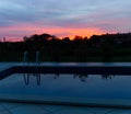 Sunset and swimming pool Royalty Free Stock Photo