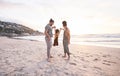 Sunset, swing and holding hands with family at beach for bonding, summer vacation and travel. Smile, happy and relax Royalty Free Stock Photo
