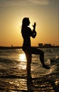 Sunset Tai Chi on a beach Royalty Free Stock Photo