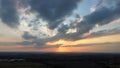 Sunset taken using drone at 120m above Starbeck Harrogate North Yorkshire England United Kingdom Clouds blue sun red orange grey Royalty Free Stock Photo