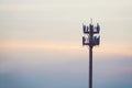 Sunset and Tall mast with cellular antenna Royalty Free Stock Photo