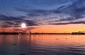 Sunset Tallinn . Old town Panorama starry night and moon on sky,summer night seascape city light reflexion on water in harbor ,B