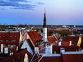 Sunset Tallinn old town red roofs medieval panorama  moon skyline  clouds blue sky sun down summer  weather Baltic sea on hor Royalty Free Stock Photo