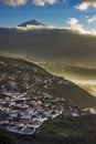 Sunset on tenerife island with view on villages on slope and teide volcano