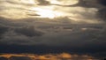 sunset among thick cumulus clouds Royalty Free Stock Photo