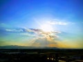 Sunset with storm clouds over mountains Royalty Free Stock Photo