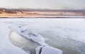 Sunset time next to icy lake