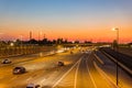 Sunset traffice over Highway 40 and cityscape Royalty Free Stock Photo