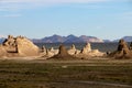 Sunset on Trona Pinnacles in Southern California with mountains in background Royalty Free Stock Photo