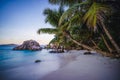 Sunset at tropical beach Anse Patates with granite boulders on La Digue Island, Seychelles Royalty Free Stock Photo