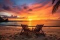 sunset on a tropical beach with two lounging chairs side by side Royalty Free Stock Photo