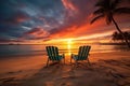 sunset on a tropical beach with two lounging chairs side by side Royalty Free Stock Photo