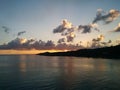 Sunset at tropical island with clouds and sea Royalty Free Stock Photo