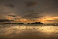 Sunset on the tropical sandy beach during low tide on the Koh Chang island in Thailand. Royalty Free Stock Photo