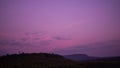 Sunset twilight gradient purple pink night sky with mountain