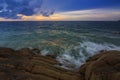 Sunset Twilight with ocean flow over the rocks at Borneo