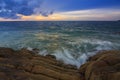 Sunset Twilight with ocean flow over the rocks at Borneo