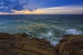 Sunset Twilight with ocean flow over the rocks at Borneo