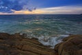 Sunset Twilight with ocean flow over the rocks at Borneo