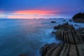 Sunset Twilight with ocean flow over the rocks at Borneo