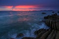 Sunset Twilight with ocean flow over the rocks at Borneo