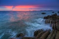 Sunset Twilight with ocean flow over the rocks at Borneo