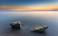 Sunset and tworocks in the silky water