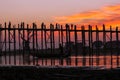 Sunset at the U Bein Bridge at the Taungthaman Lake near Amarapura, Myanmar Royalty Free Stock Photo