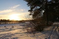 Sunset under field full of snow Royalty Free Stock Photo