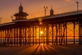 Sunset under North Pier, Blackpool, Lancashire, UK Royalty Free Stock Photo