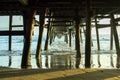 Sunset from under a pier with symmetrical look Royalty Free Stock Photo