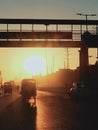 Sunset under a walking bridge on road Royalty Free Stock Photo