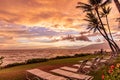 A sunset of unusually warm yellow-amber colors over Pacific ocean viewed from Kamaole beach II, Kihei, Maui. Royalty Free Stock Photo