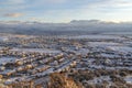 Sunset in Utah Valley with homes on a snowy neighborhood with mountain view