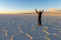 Tourist in Uyuni Salt Desert at Sunset, Bolivia