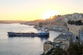 Sunset in Valleta, Malta. Old harbour at sunset with overview of Royalty Free Stock Photo