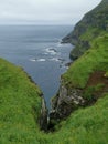 Sunset vieepoint in GÃ¡sadalur village, cliff with view at the sea and Mykines Island, VÃ¡gar, Faroe Islands