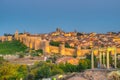 Sunset view of Avila from los cuatro postes viewpoint, Spain Royalty Free Stock Photo