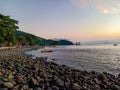 Sunset view on the beach in fisherman village Aerbanua, Talise island, North Sulawesi, Indonesia