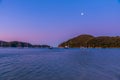 Sunset view of boats mooring at Torrent bay at Abel Tasman national park in New Zealand Royalty Free Stock Photo