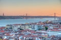 Sunset view of Bridge of 25th April and National sanctuary of Cristo Rei in Lisbon, Portugal Royalty Free Stock Photo