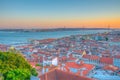 Sunset view of Bridge of 25th April and National sanctuary of Cristo Rei in Lisbon, Portugal Royalty Free Stock Photo