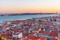 Sunset view of Bridge of 25th April and National sanctuary of Cristo Rei in Lisbon, Portugal Royalty Free Stock Photo