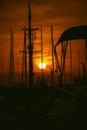 Sunset view at a busy shipyard with fiery sky background Royalty Free Stock Photo