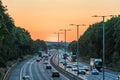 Sunset view of busy UK Motorway traffic in England