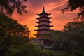 sunset view of china pagoda with orange and pink hues visible in the sky