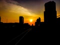 The silhouette of the building and tracks of BTS in the evening, Sunset view in Bangkok, Thailand Royalty Free Stock Photo