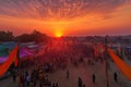 a sunset view of a colorful cultural festival, with the setting sun casting an orange glow