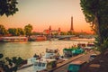 Sunset view of  Eiffel Tower, Alexander III Bridge and river Seine in Paris, France Royalty Free Stock Photo