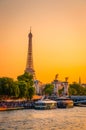 Sunset view of  Eiffel Tower, Alexander III Bridge and river Seine in Paris, France Royalty Free Stock Photo